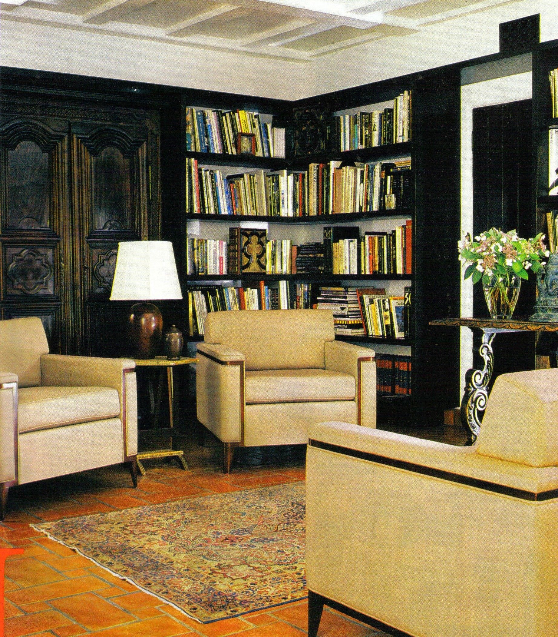 Mid-century modern library lounge with built-in bookshelves